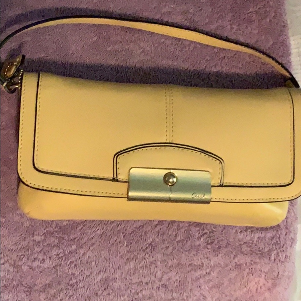Yellow leather Coach wristlet